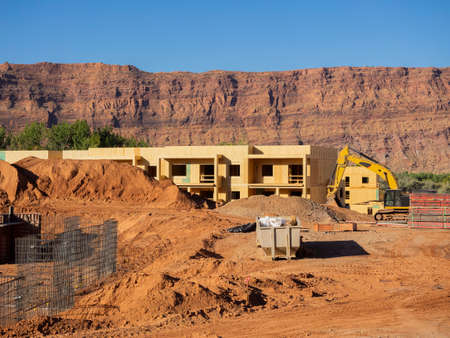 New apartment building under construction on sunny day on blue sky backgroundの写真素材