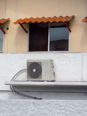 Air condition units near windowの写真素材