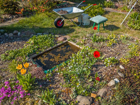 fragment of the garden during spring cleaning works on a sunny dayの写真素材
