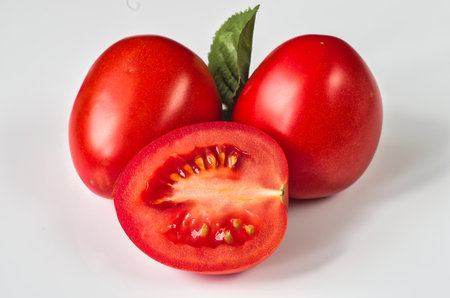 Tomatoes on a white background. Ripe red tomatoes on a white background.の写真素材