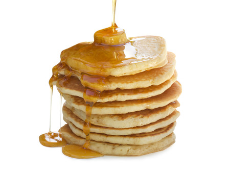 A stack  of pancakes with maple syrup and melted butter  Isolated on white の写真素材