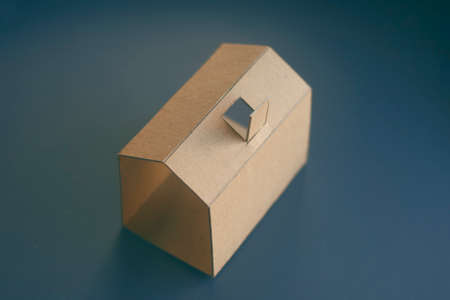 Paper house on a dark backgroundの写真素材