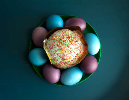 Easter cake and colorful eggs around it. Top viewの写真素材