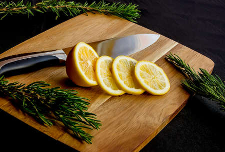 Fresh juicy sliced lemon on a cutting board. close upの写真素材