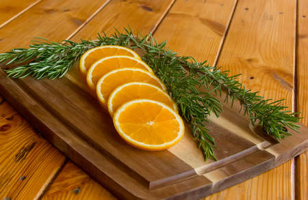Juicy beautiful slices of ripe orange on a cutting board. close upの写真素材
