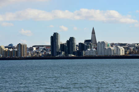 View of the city of Reykjavík ships sailing on the seaの写真素材
