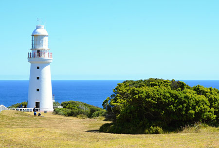 A white lighthouse on the rocky coast of South Australia near Melbourneの写真素材