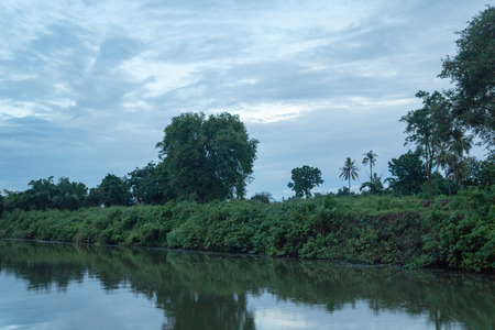 Boat trip on the river Kwai with sunsetの写真素材