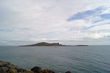 Coast at Old Howth Harbor. The lighthouse guards the entrance to the port of Howth.の写真素材