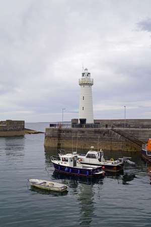 The lighthouse at the entrance to the port of Donaghadee was the first Irish lighthouse to be converted to electric operation.の写真素材