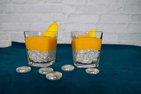 Dessert with mango puree arranged in a glassの写真素材