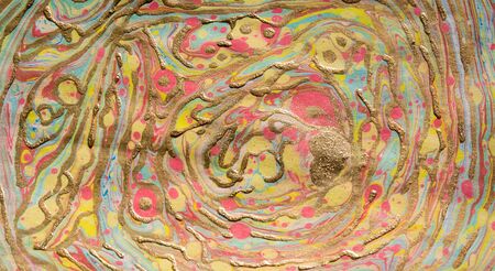 Golden ebru hand drawn pattern. Marbled background