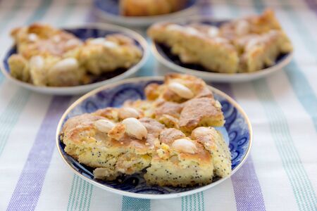 Corn flour cake with almonds on blur backgroundの写真素材