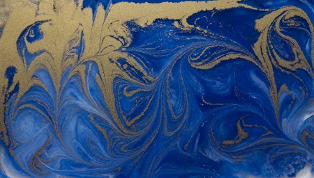 Blue and golden liquid texture, watercolor hand drawn marbling illustration, abstract background.の写真素材