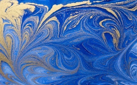 Blue and golden liquid texture, watercolor hand drawn marbling illustration, abstract background.の写真素材