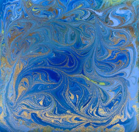 Blue and golgen liquid texture, watercolor hand drawn marbling illustration, abstract background.の写真素材
