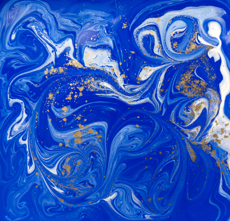 Blue and gold liquid texture. Hand drawn marbling background. Ink marble abstract patternの写真素材