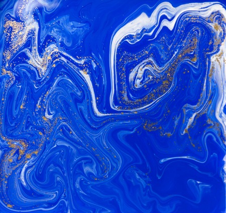 Blue and gold liquid texture. Hand drawn marbling background. Ink marble abstract patternの写真素材