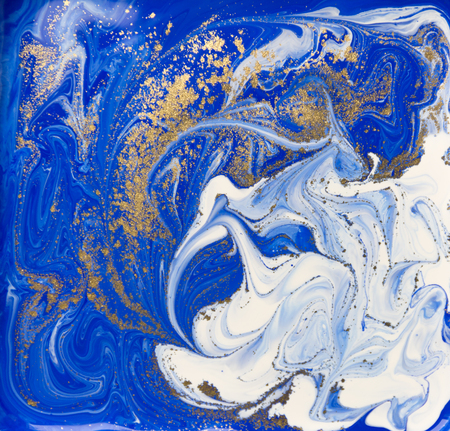 Blue and gold liquid texture. Hand drawn marbling background. Ink marble abstract patternの写真素材
