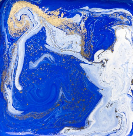 Blue and gold liquid texture. Hand drawn marbling background. Ink marble abstract patternの写真素材