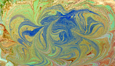 Green, blue and golden liquid texture. Hand drawn marbling background. Ink marble abstract patternの写真素材