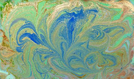 Green, blue and golden liquid texture. Hand drawn marbling background. Ink marble abstract patternの写真素材