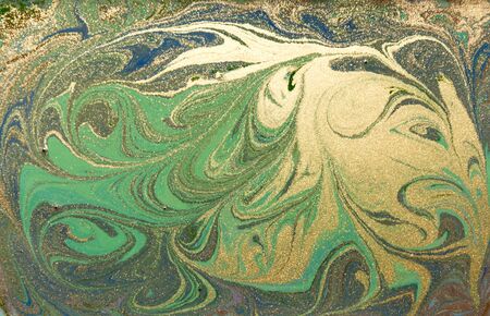 Green and golden liquid texture. Hand drawn marbling background. Ink marble abstract patternの写真素材