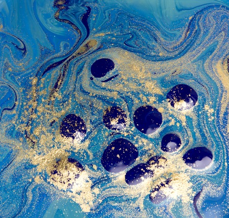Blue and gold liquid texture. Hand drawn marbling background. Ink marble abstract patternの写真素材