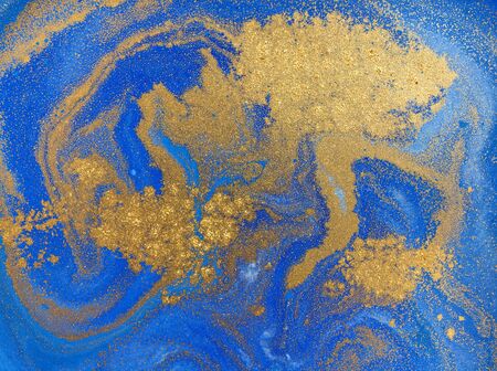 Blue and golden liquid texture, watercolor hand drawn marbling illustration, abstract background.の写真素材
