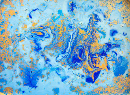 Blue and golden liquid texture, watercolor hand drawn marbling illustration, abstract backgroundの写真素材