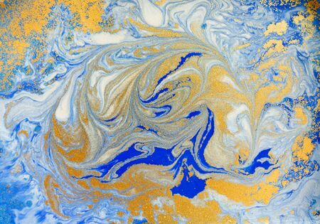 Blue and golden liquid texture, watercolor hand drawn marbling illustration, abstract backgroundの写真素材
