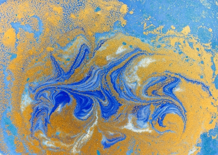Blue and golden liquid texture, watercolor hand drawn marbling illustration, abstract backgroundの写真素材