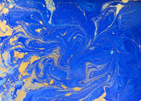 Blue and golden liquid texture, watercolor hand drawn marbling illustration, abstract backgroundの写真素材