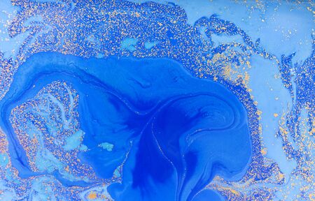 Blue and golden liquid texture, watercolor hand drawn marbling illustration, abstract backgroundの写真素材