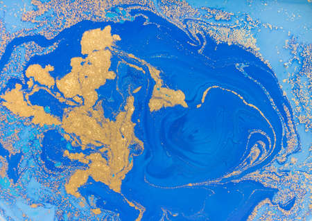 Blue and golden liquid texture, watercolor hand drawn marbling illustration, abstract backgroundの写真素材