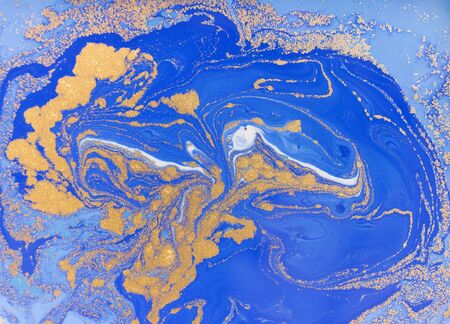 Blue and golden liquid texture, watercolor hand drawn marbling illustration, abstract backgroundの写真素材