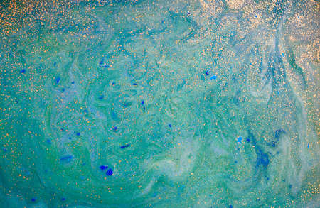 Green and gold liquid texture, watercolor hand drawn marbling illustration, abstract backgroundの写真素材