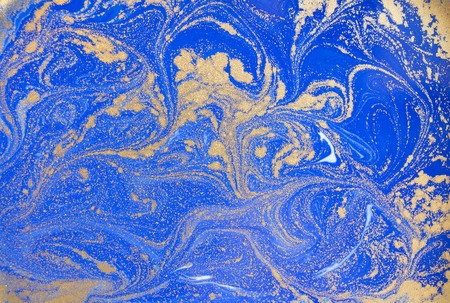 Blue and golden liquid texture, watercolor hand drawn marbling illustration, abstract backgroundの写真素材
