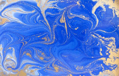 Blue and golden liquid texture. Watercolor hand drawn marbling illustration. Ink marble background.の写真素材