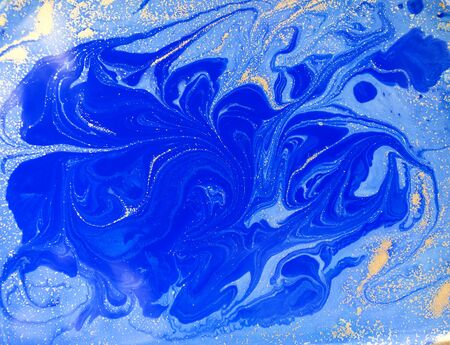 Blue and golden liquid texture, watercolor hand drawn marbling illustration, abstract backgroundの写真素材