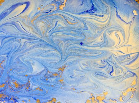 Blue and golden liquid texture. Watercolor hand drawn marbling illustration. Ink marble background.の写真素材