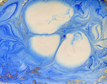 Blue and golden liquid texture. Watercolor hand drawn marbling illustration. Ink marble background.の写真素材