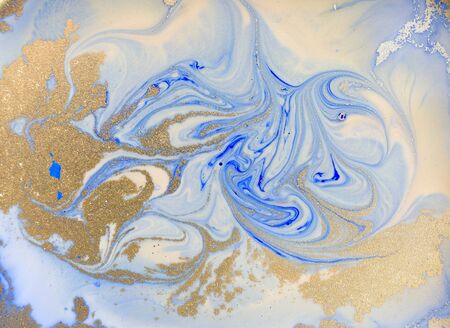 Blue and golden liquid texture. Watercolor hand drawn marbling illustration. Ink marble background.の写真素材