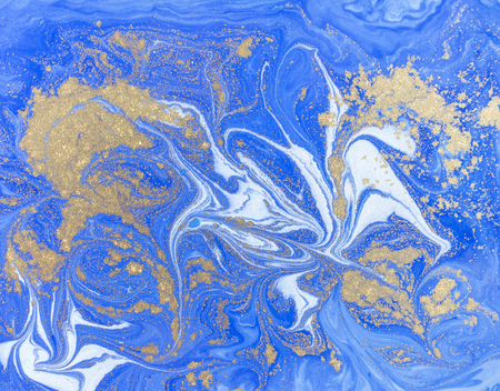 Blue and golden liquid texture. Watercolor hand drawn marbling illustration. Ink marble background.の写真素材