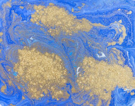 Blue and golden liquid texture. Watercolor hand drawn marbling illustration. Ink marble background.の写真素材
