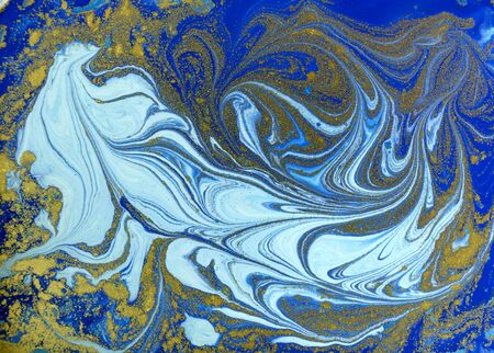 Blue and golden liquid texture. Watercolor hand drawn marbling illustration. Ink marble background.の写真素材