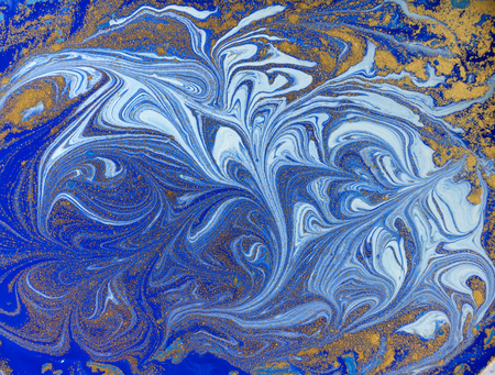 Blue and golden liquid texture. Watercolor hand drawn marbling illustration. Ink marble background.の写真素材
