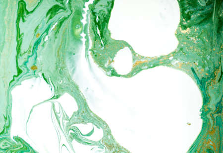 Marbled green and golden abstract background. Liquid marble patternの写真素材