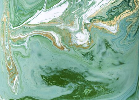 Marbled green and golden abstract background. Liquid marble patternの写真素材