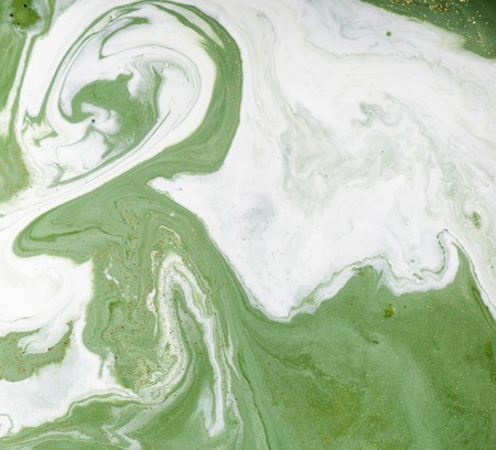 Marbled green and golden abstract background. Liquid marble pattern.の写真素材